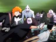 Ichigo kicks Uryū in the head for talking too much.