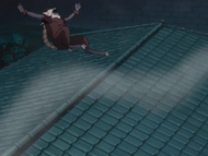 Haineko knocks the Arrancar clone off the roof.