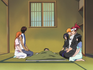 Rukia and her friends watch over the injured child.