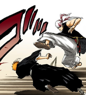 Ganju kicks Ichigo in the head.