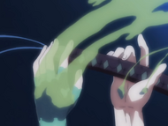 Ichigo's grip on his Zanpakutō loosens due to the effects of Vitriol Shot.