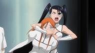 Loly threatens Orihime's eye.