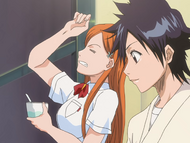 Orihime suffers a brain freeze while eating shaved ice with Tatsuki.