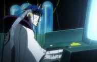Mayuri sits at his computer with dozens of wires attached to him.