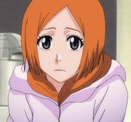 Orihime wearing a coat.