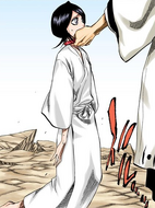 Rukia fails to stand up due to Aizen's intense Reiatsu.