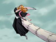 One of the Arrancar clones strikes Rangiku with his tail.