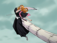 An Arrancar clone strikes Rangiku in the back with its tail.