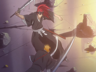 Renji dodges Ichigo's attack.