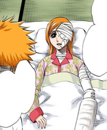 Orihime assures Ichigo that he is not responsible for her injuries.