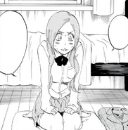 Orihime sits embarrassed in Ichigo's bedroom.