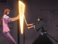 Rukia attacks Orihime, who blocks with Santen Kesshun.