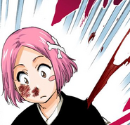 Yachiru is cut by Guenael's attack.