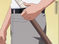 Ikkaku carries a wooden sword through his belt.