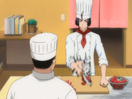 Yumichika cuts up strawberries at Heita's direction.