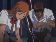 Orihime and Sado recover after spitting up the water in their systems.