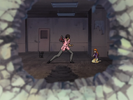 Yoruichi watches as Sado destroys a wall with an energy blast.