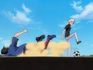 Hitsugaya takes the soccer ball from one of the middle school students.