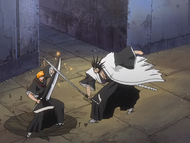 Kenpachi strikes Ichigo with enough force to crater the ground.