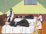 Unohana watches as Izuru and Hisagi are tended to.