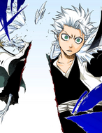 Hitsugaya's ice clone is cut in two by Harribel.