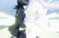 Ice begins to encase Rukia's body.