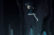 Yoruichi leaps from stalactite to stalactite.