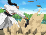 Ichigo blocks a punch from Yammy using his sword.