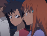 Tatsuki glances at Orihime, worried.