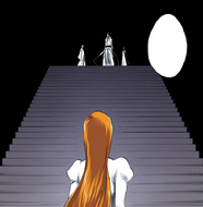 Tōsen and Gin stand alongside Aizen as he greets Orihime.