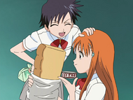 Tatsuki pats Orihime affectionately.