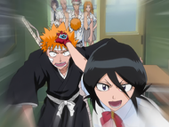 Rukia pulls Ichigo's Shinigami form out of his body.