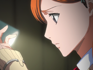 Orihime looks at the bracelet.