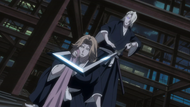 Reigai-Izuru holds Wabisuke to Rangiku's neck.