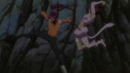 Haineko attempts to hit Yoruichi with a two-handed punch.