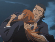 Aramaki chops Orihime on the neck for biting him.