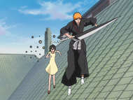 Gesell pursues Rukia and Ichigo across the rooftop.