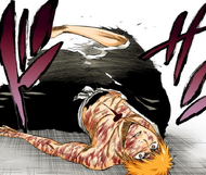 Ichigo rolls over after being kicked by Grimmjow, revealing the hole in his chest.