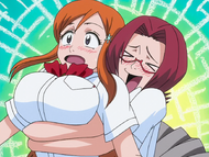 Chizuru gropes Orihime from behind while welcoming her back.