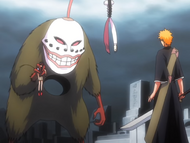 Grand Fisher holds Karin hostage against Ichigo.