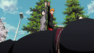 Ichigo and Uryū knock Obuta to the ground.