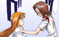 Chizuru is forced to grab Orihime while under the influence of Bulb Scatter.