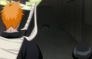 Rukia and Ichigo come across the body.