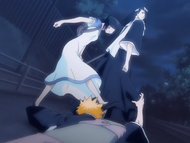 Rukia kicks Ichigo's hand away from Byakuya.