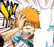 Ichigo presses his badge to Kon's forehead to knock out his pill.