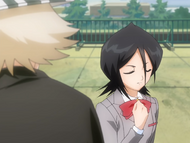 Rukia takes Kon's pill from Urahara.