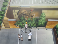 Ichigo and his family survey the damage to their house.