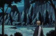 Ichigo looks toward a nearby cluster of rocks.