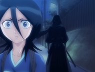 Byakuya appears behind Rukia.