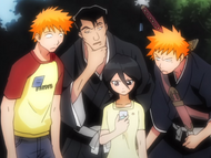 Ichigo, Kon, and Saidō look at Rukia's Denreishinki.